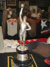 P21 KANUIT taller basketball trophy hand in air.JPG (75836 bytes)